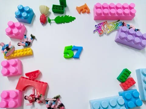 Children's colored plastic Block Bricks. Colorful kids toys frame on white .. Stock Photos