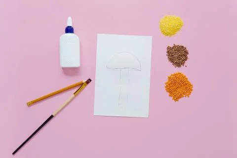 Children's crafts using different cereals. step by step instruction. Step one - Stock Photos