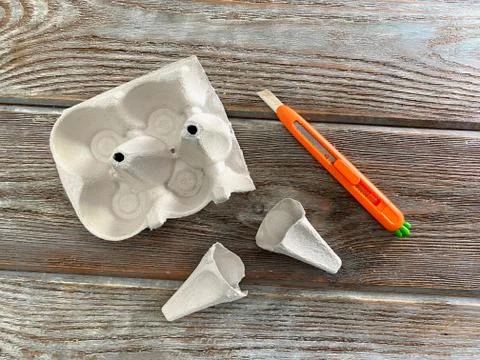 Children's creative how to make ice cream from an egg box. Stock Photos
