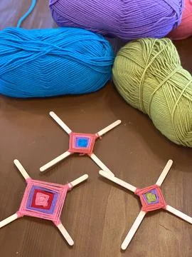 Children's creativity, a mandala made of colored yarn. Stock Photos