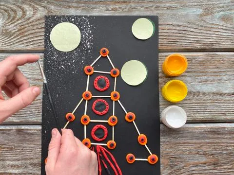 Children's creativity, rocket in space, from plasticine and matches, Stock Photos