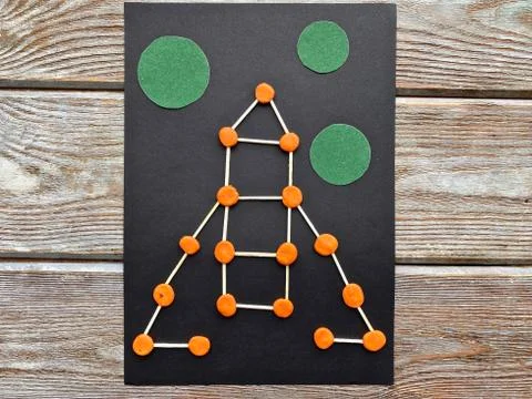 Children's creativity, rocket in space, from plasticine and matches, Stock Photos