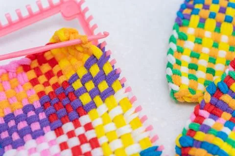 Childrens creativity weaving with colored threads ropes Stock Photos