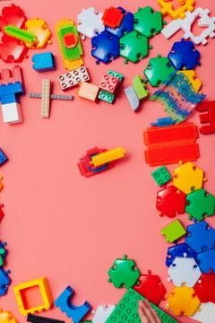 Children's developing games collect designer on a pink background Stock Photos