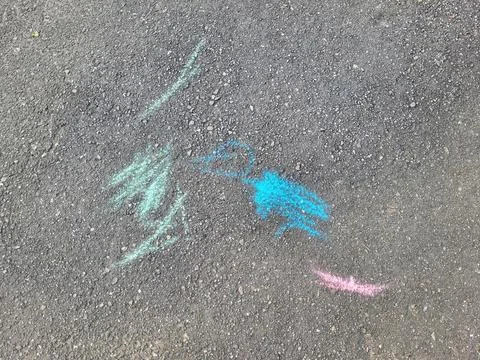 Children's drawings are scribbles on the pavement on a summer day. Children.. Stock Photos