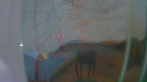 Children's drawings on translucent surface Stock Footage 73589548