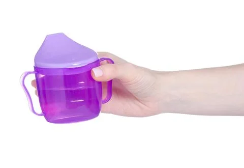 Children's drinking mug in hand Stock Photos