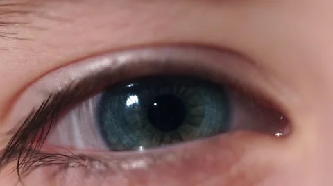 An Children's Eye Blinks And Changes Color Blue to the Green. Stock Footage 60578045