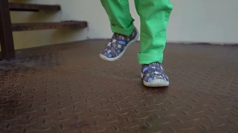 Children's feet in gray sandals Stock Footage 109111853