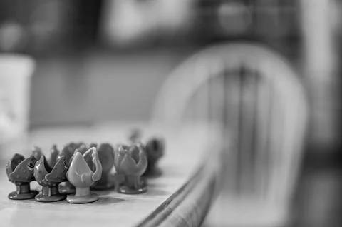 Children's game of using a miniature pole and line lowered into open plastic Foto stock