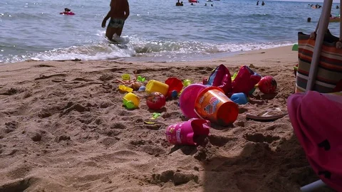Children's games under parasol with audio Stock Footage