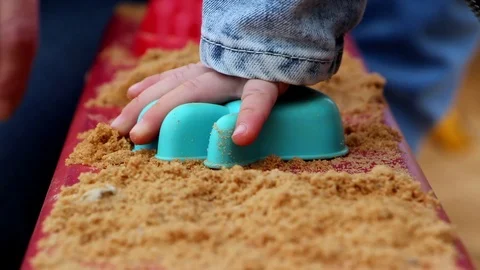 Children's hand playing with sand Stock Footage 91589192