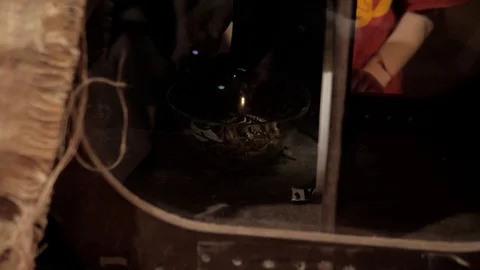 Children's hand is trying to get note in cup with worms located behind glass Stock Footage 127506093