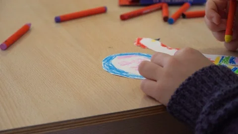 Children's hands are engaged in creativity. Painting at the Table Stock Footage 98921150