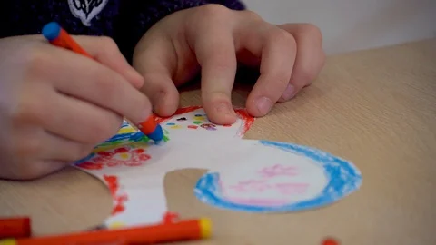 Children's hands are engaged in creativity. Painting at the Table Stock Footage 98921207