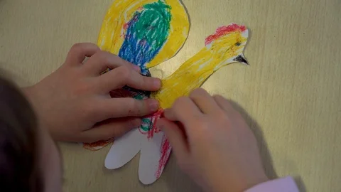 Children's hands are engaged in creativity. Painting at the Table Stock Footage 98921255