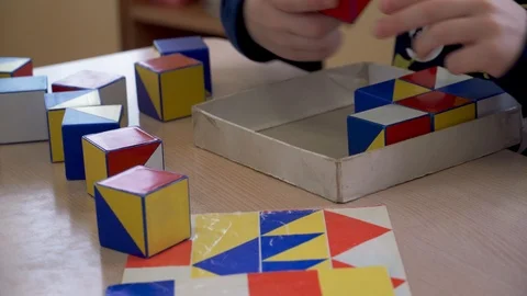 Children's hands are engaged in creativity. Colored cubes Stock Footage 98921430