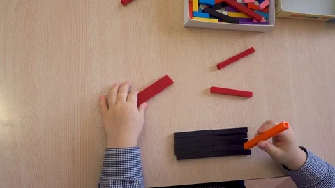 Children's hands are engaged in creativity. Painting at the Table Stock Footage 98921491