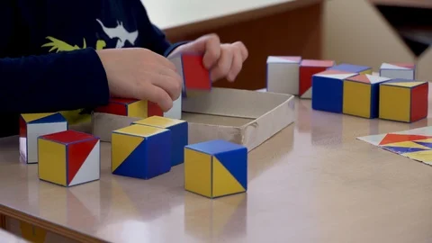 Children's hands are engaged in creativity. Colored cubes Stock Footage 98921552