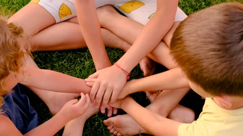 Children's hands on the grass. Selective focus. Stock Footage 295479548