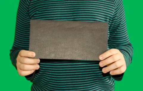 Children's hands hold an empty black envelope Foto stock