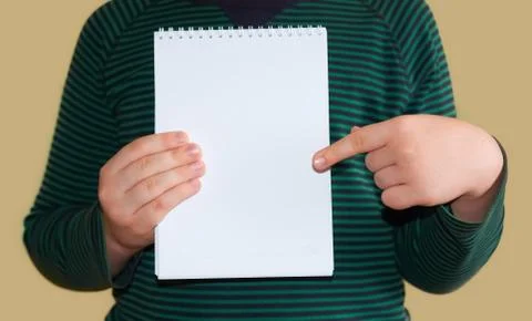 Children's hands hold an empty white envelope Stock Photos
