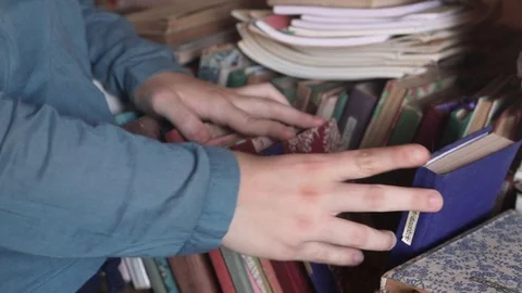 Children's hands leafing through old books  Stock Footage 108133652