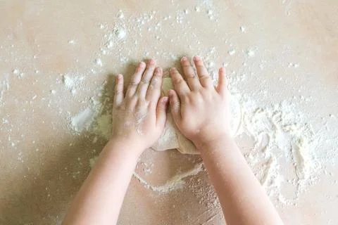Children's hands make dough Stock Photos