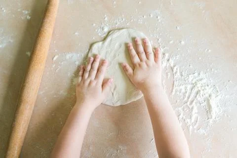Children's hands make dough Stock Photos