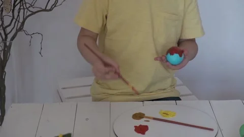 Children's hands paint Easter eggs Stock Footage 147950968
