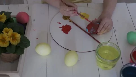 Children's hands paint Easter eggs Stock Footage 147950969