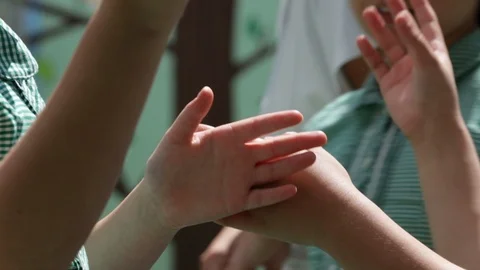 Children's hands playing in playground Stock Footage 103327216