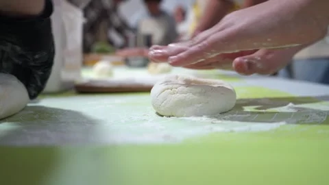Childrens hands rolling out dough Stock Footage 318167310