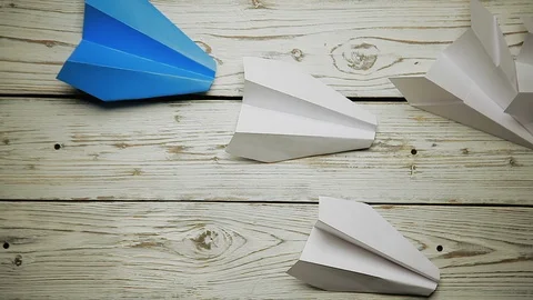 Children's hands run planes of paper Stock Footage 88434847
