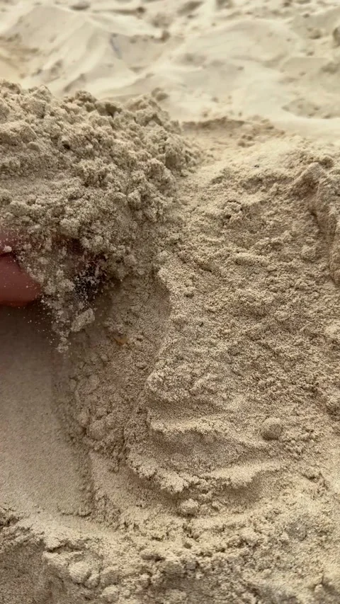 Children's hands scooping sand on the beach, building a sandcastle with creat Stock Footage 302471235