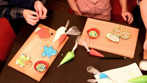 Children's hands shift on the sle with gingerbread dyes Stock Footage 125145105
