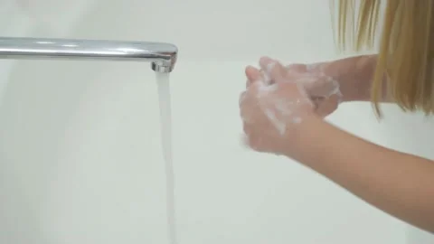 Children's hands in soapy foam, close-up. Wash your hands in the bathroom. Stock Footage 146029663