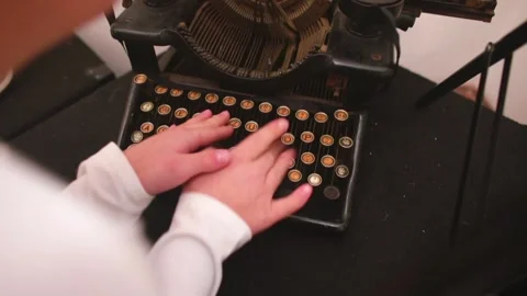 Children's hands touch the keys of an old typewriter. A keyboard from the past. Stock Footage 144545270