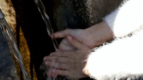 Children's hands under the stream of water, close-up Stock Footage 90868547