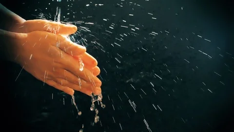 Children's hands under a stream of water. Solar spray. The child washes his Stock Footage 127205497