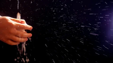 Children's hands under a stream of water. Solar spray. The child washes his Stock Footage 127206020