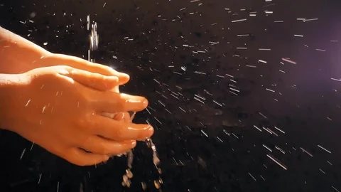 Children's hands under a stream of water. Solar spray. The child washes his Stock Footage 127206959