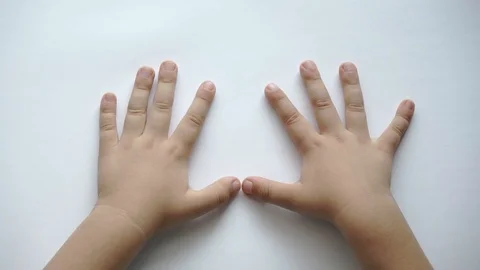 Children's hands on white background show gestures Stock Footage 114708074