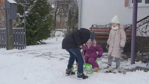 Children's joys of a snowy winter Stock Footage 326467656