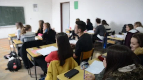 Children's learning in elementary school. Pupils exercising Stock Footage 98662417