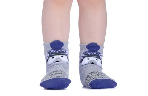 Children's legs in socks Stock Photos