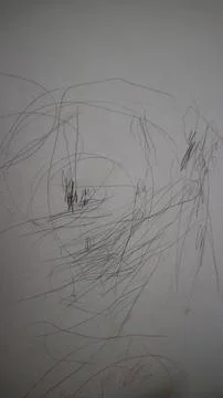 Children's messy scribble art creating abstract lines and shapes on a white.. Stock Photos