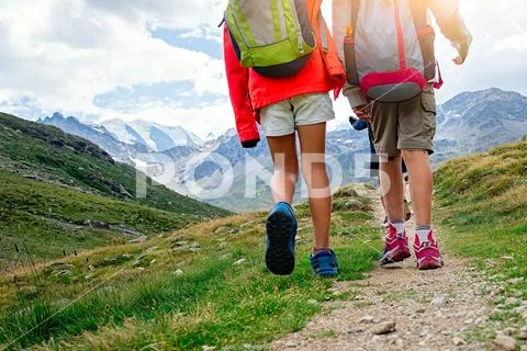 Children's mountain hike during a summer camp on the Swiss alps Stock Photos