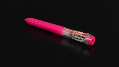 Children's multi-colored pen on a black background. Stock Footage 221126507