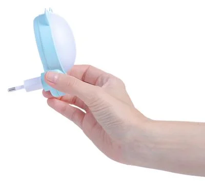 Children's night light socket in hand Stock Photos